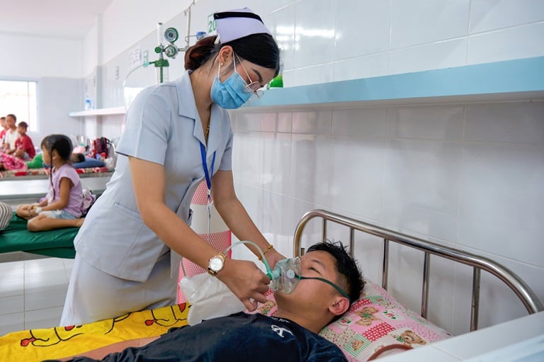 Staff checking the oxygen regulator